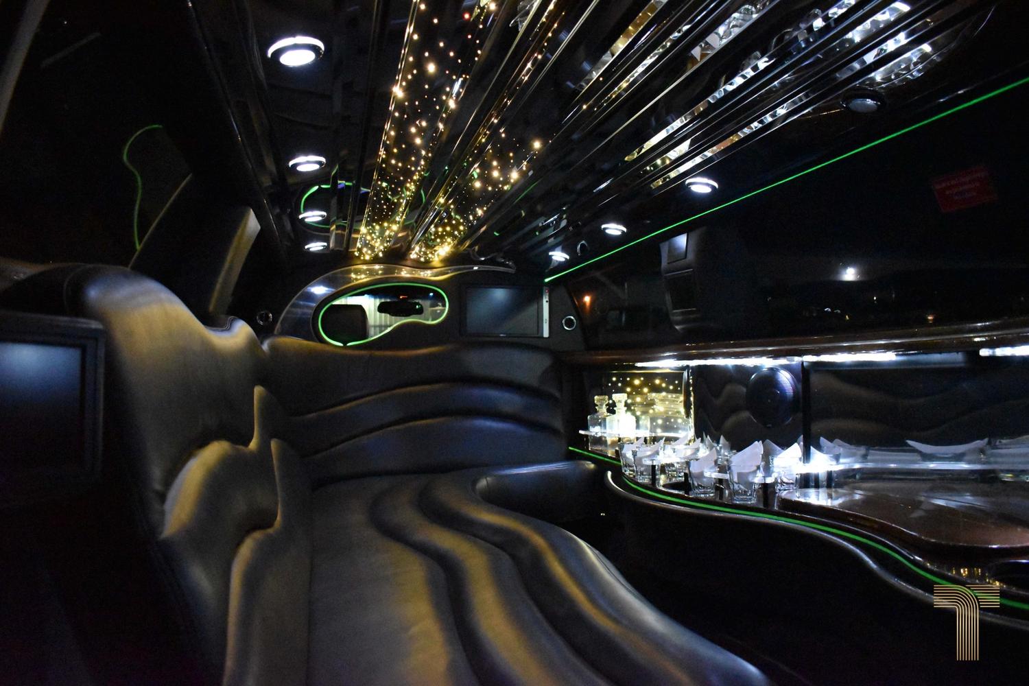 Stretch limousine interior with wraparound leather seating